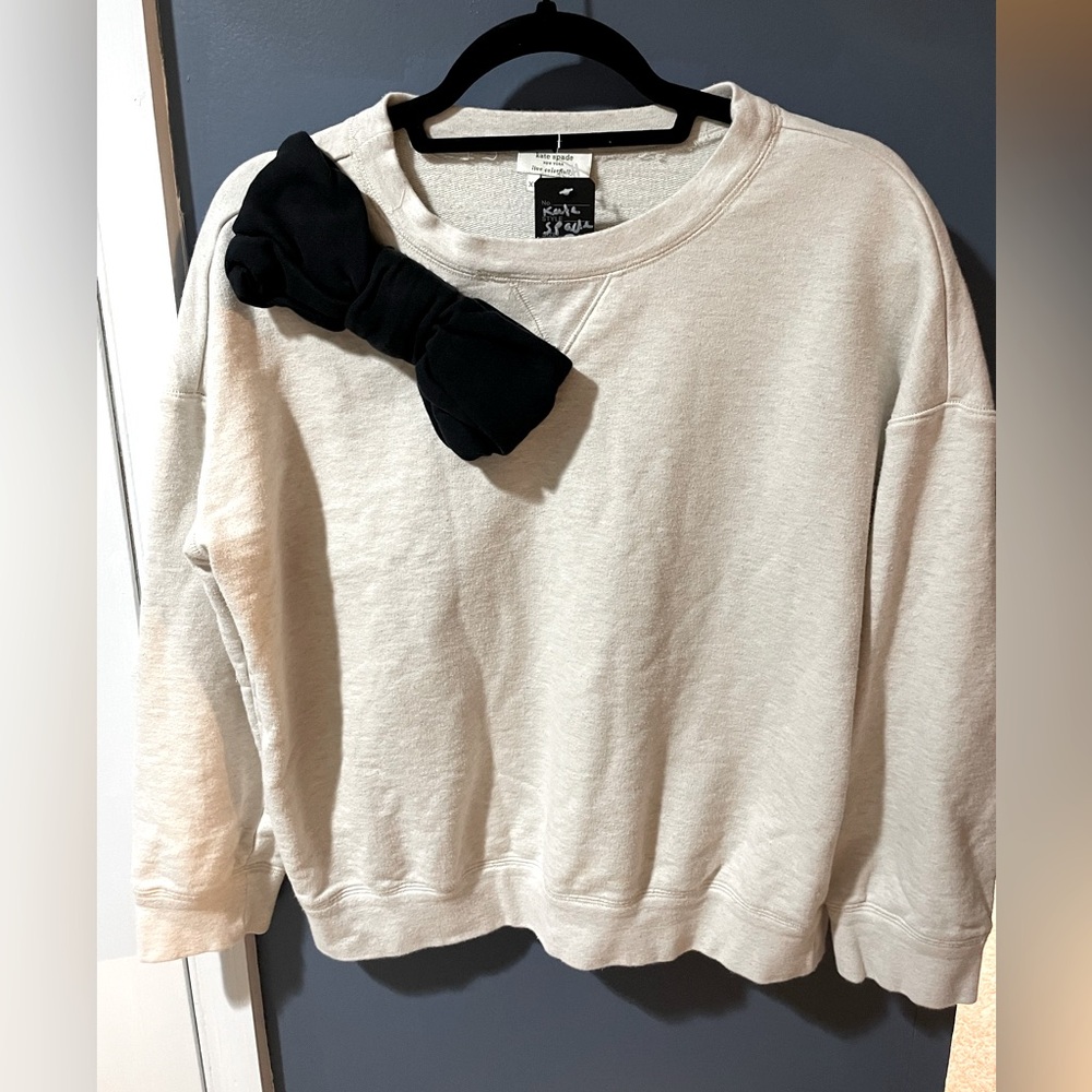 Kate spade oatmeal beige xs crew neck sweater with massive black bow.